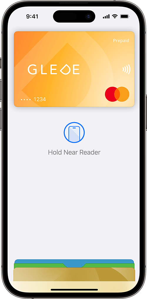 iPhone using Apple Pay held next to a contactless payment terminal